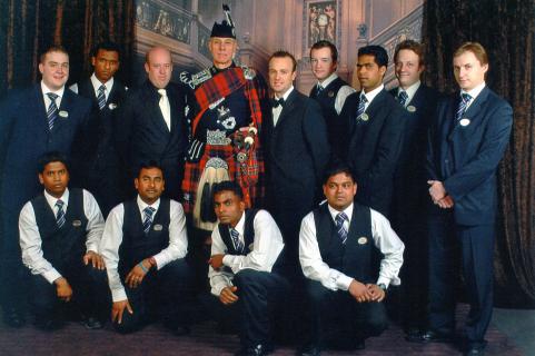 piper and hotel staff